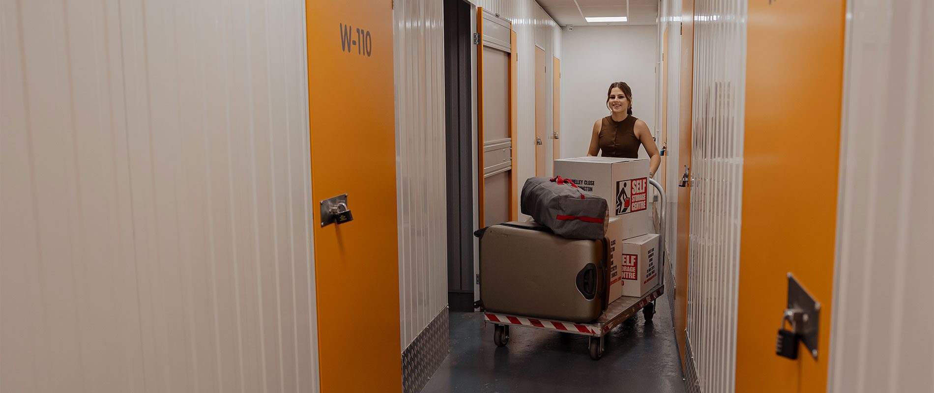 Lucy pushing the trolley inside the facility