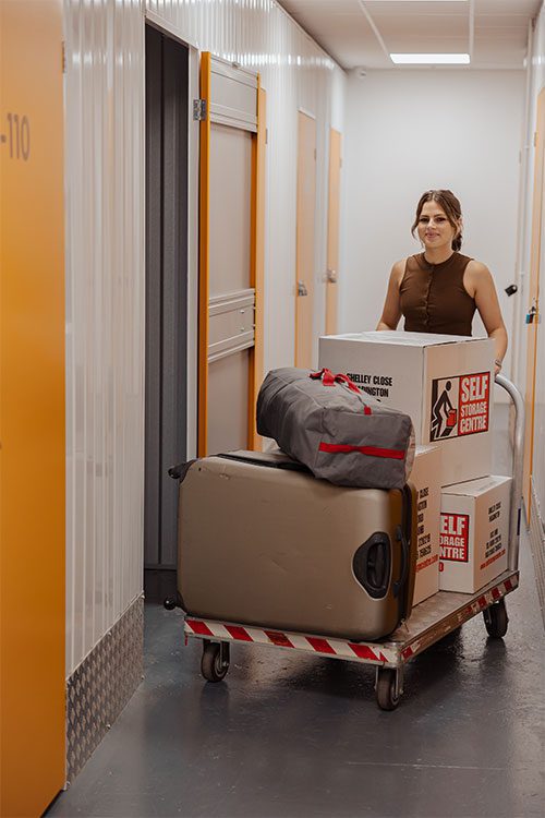 Lucy pushing the trolley inside the facility